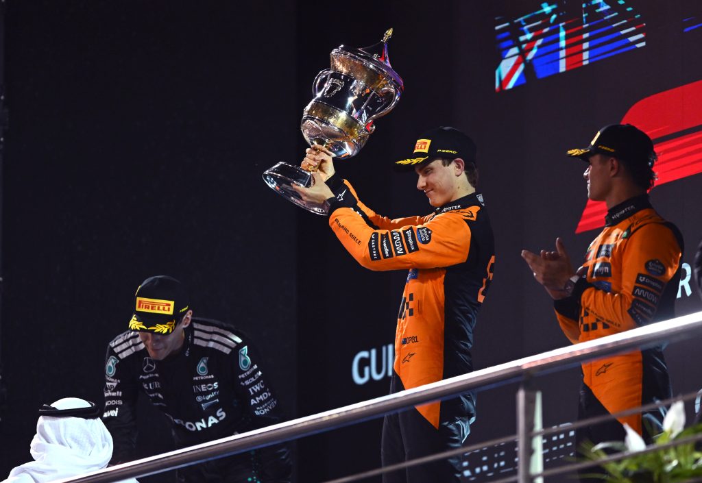 Race winner Oscar Piastri of Australia and McLaren lifts his trophy on the podium during the F1 Grand Prix of Bahrain at Bahrain International Circuit