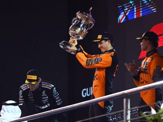 Race winner Oscar Piastri of Australia and McLaren lifts his trophy on the podium during the F1 Grand Prix of Bahrain at Bahrain International Circuit